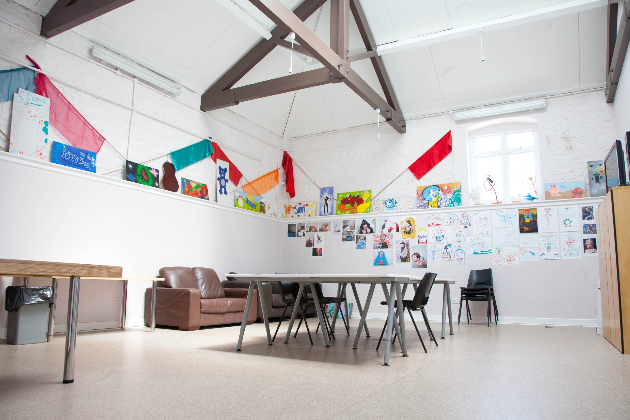Bright studio with colourful decorations.