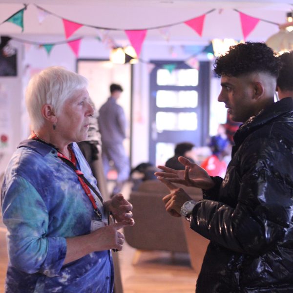 Youth worker and young person talking in chill out space